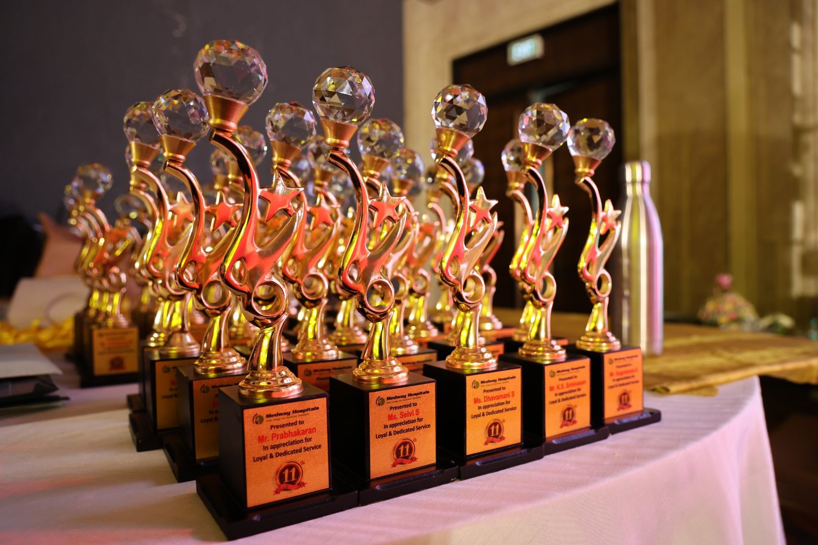Rows of event awards and trophies ready for presentation